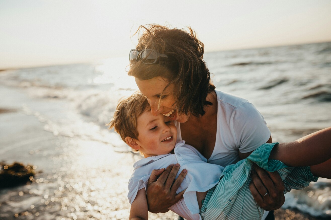 https://unsplash.com/photos/photo-of-mother-and-child-beside-body-of-water-ry_sD0P1ZL0